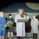 Then U.S. President George H. Bush, accompanied by first lady Barbara (left), makes farewell remarks before departing Andrews Air Force Base, Maryland, on Air Force One for a trip to Australia and Asia in 1991. (AP Photo/Greg Gibson, File)