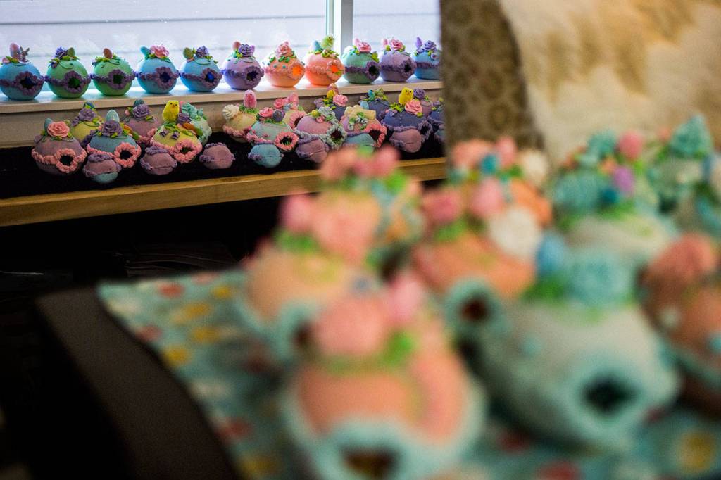 A few hundred sugar eggs sit on the table and windowsill of Darla Aikens home in Lynnwood.                                 (Olivia Vanni / The Herald)