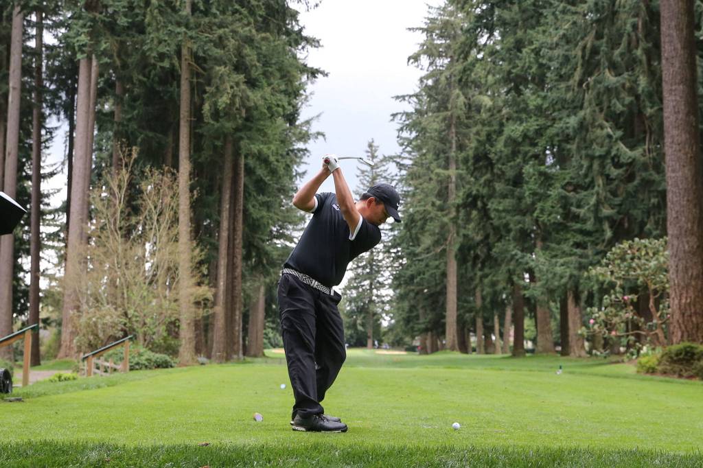 Kamiaks Devin Kim tees off during the Tom Dolan Memorial Invitational golf tournament Monday afternoon at Everett Golf & County Club in Everett on April 8, 2019. Kim finished third with 69 and -3. (Kevin Clark / The Herald)