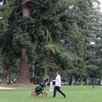 Kamiaks Alvin Kwak makes his way down a green during the Tom Dolan Memorial Invitational golf tournament Monday afternoon at Everett Golf & County Club in Everett on April 8, 2019. (Kevin Clark / The Herald)