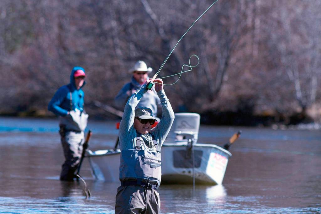 Paul Tetzlaff of Marysville sets the hook while fishing for trout on the Yakima River. (Mike Benbow photo)