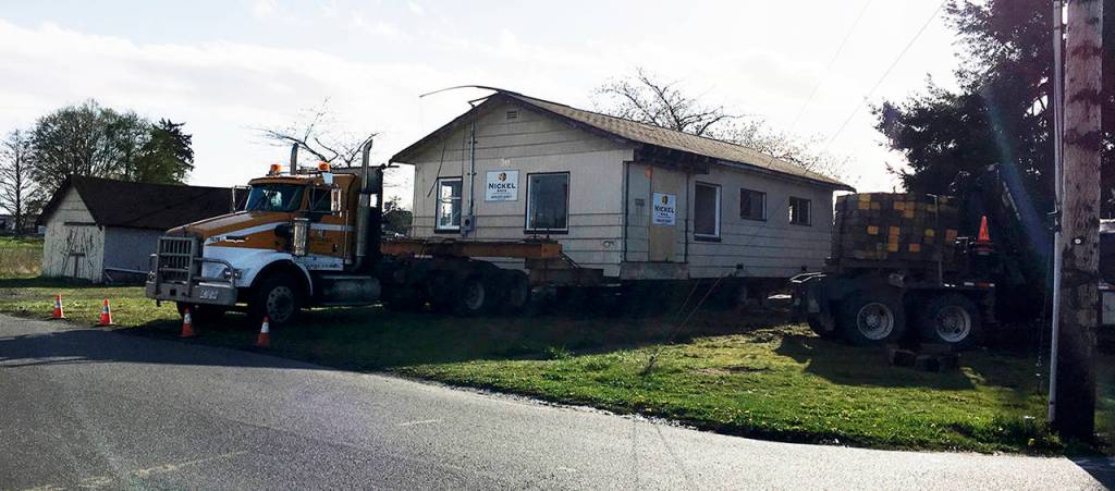 The house formerly at 1328 Eighth St. in Marysville was loaded onto a truck Tuesday evening. It was built in 1901. (Connie Mennie / City of Marysville)