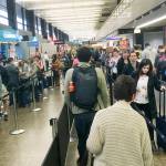Sea-Tac airport gets pretty crowded during spring break. Here, people wait in security checkout lines in May 2018. (Sue Misao / Herald file)