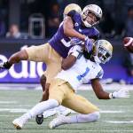 Washingtons Myles Bryant (3) breaks up a pass intended for UCLAs Soso Jamabo during a game at Husky Stadium in 2017. (Kevin Clark / The Herald)