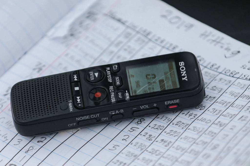 Payne Patchett uses a recorder and a detailed collection of stats and notes. (Kevin Clark / The Herald)