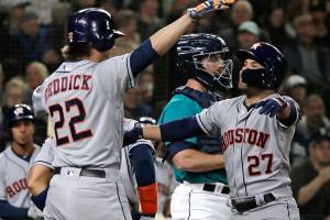 Astros hit 2 grand slams, snap M’s win streak