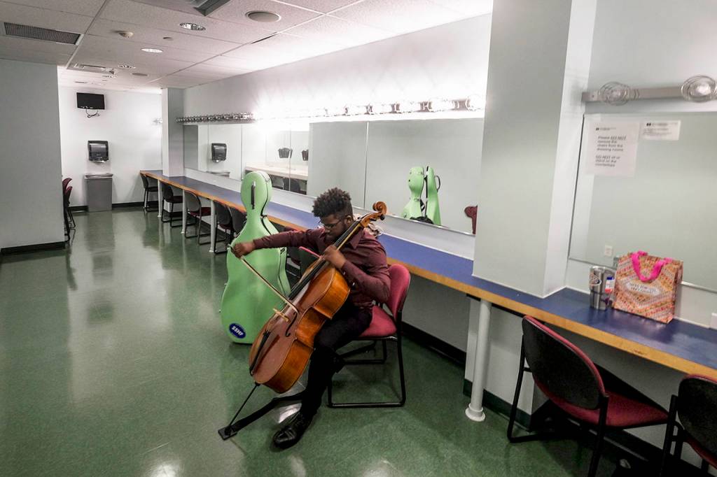 When he first started playing the cello, Adams learned where to put his fingers and how to hold the bow by watching YouTube videos. (Jahi Chikwendiu/Washington Post)