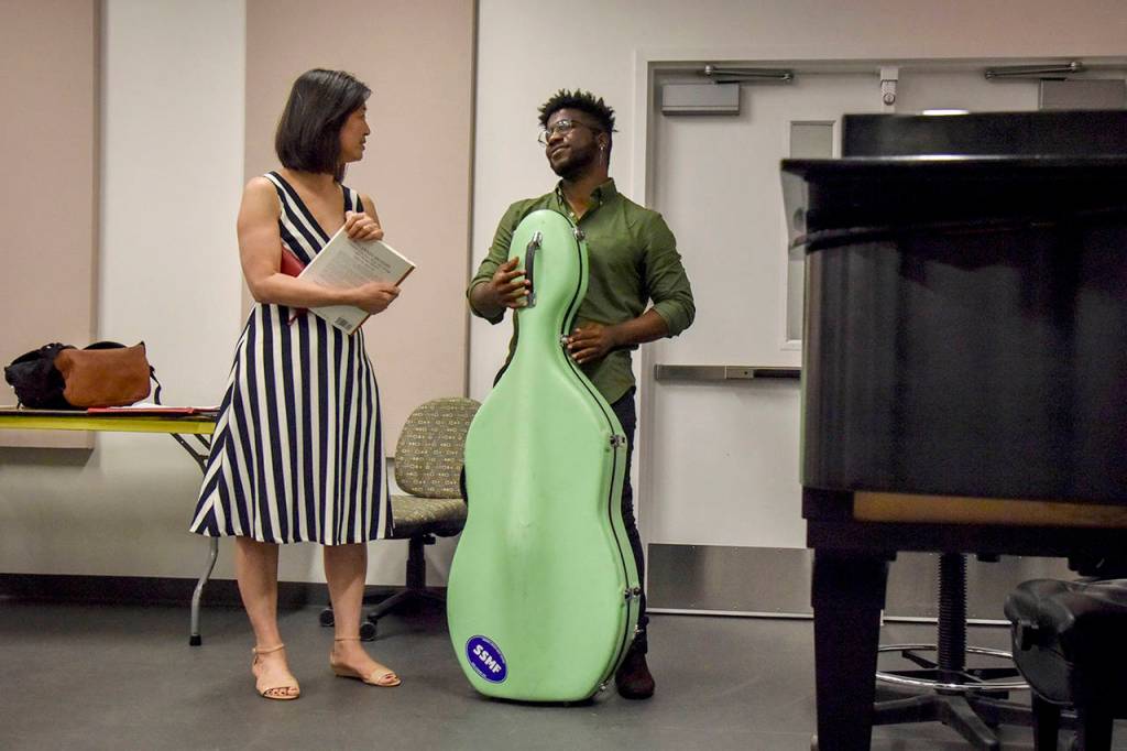 Adams chats after class with June Huang, the director of strings at George Mason Universitys School of Music. (Jahi Chikwendiu/Washington Post)