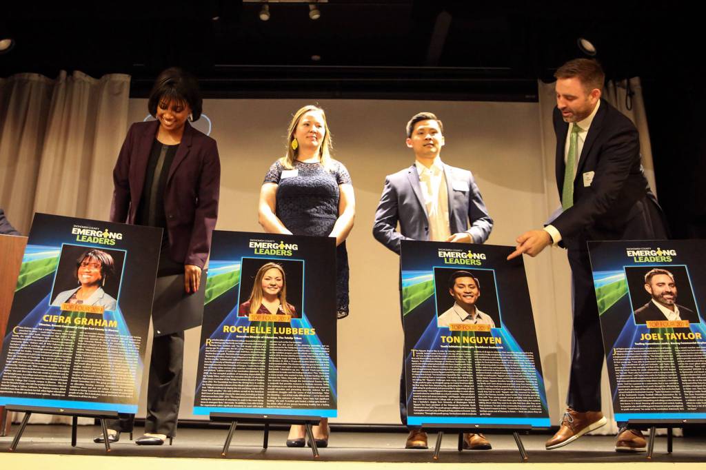 The Emerging Leaders finalists (L-R) Ciera Graham, Rochelle Lubbers, Ton Nguyen and Joel Taylor take their places on stage at the Marysville Opera House on April 11. (Kevin Clark / The Herald)