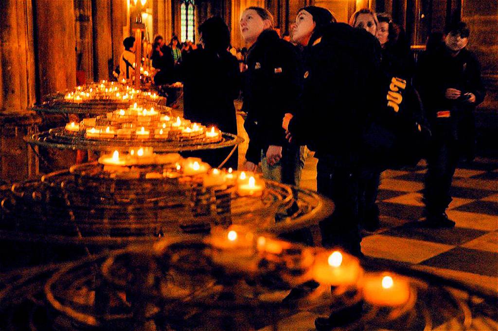 Votive candles, each one symbolizing a prayer, burned in Notre Dame Cathedral during the visit by Duane Schireman and his daughter Jiena last August. (Photo Duane Schireman)