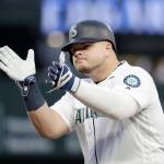 Seattles Daniel Vogelbach claps after hitting a single during Saturdays game against Houston in Seattle. (AP Photo/Elaine Thompson)