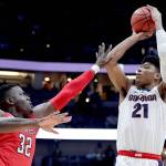 Gonzagas Rui Hachimura (right) shoots over Texas Techs Norense Odiase during the Bulldogs loss in the West Regional final March 30 in Anaheim, California. (AP Photo/Jae C. Hong)