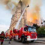 Fire fighters work at the burning Notre Dame cathedral on Monday. Experts assessed the blackened shell of Paris iconic Notre Dame Tuesday morning to establish next steps to save what remains after a devastating fire destroyed much of the cathedral that had survived almost 900 years of history. (Benoit Moser, BSPP via AP)