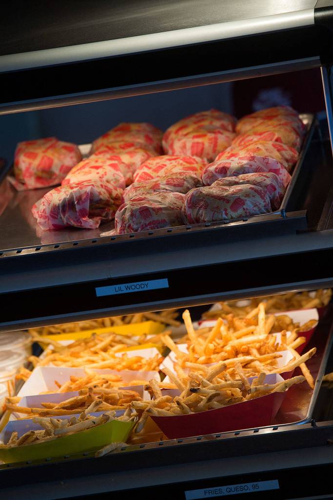 Burgers and fries from Lil Woodys await hungry Mariners fans at T-Mobile Park. Lil Woodys is a new food vendor at the ballpark this year. (Andy Bronson / The Herald)