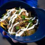 A family-sized Caribbean Nachos in a Mariners helmet from Paseo at T-Mobile Park on Thursday, March 28, 2019 in Seattle, Wash. (Andy Bronson / The Herald)