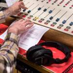Jim Hilmar preps for an edition ofFrettin Fingers, which airs at 11 a.m. Saturdays on KSER-FM. (Olivia Vanni / The Herald)