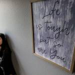 Gina Loh works as a prevention educator and in community outreach for Domestic Violence Services of Snohomish County. Encouraging words greet visitors at the agencys new South County Advocacy Center. (Dan Bates / The Herald)