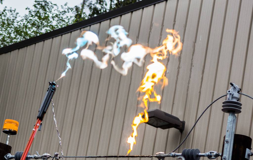An electrical arc is produced during the trailer demonstration Wednesday hosted by Snohomish County PUDin Everett. (Olivia Vanni / The Herald)