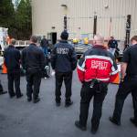 Everett Fire Deparment members listen during the demonstration hosted by Snohomish County PUD on Wednesday in Everett. (Olivia Vanni / The Herald)