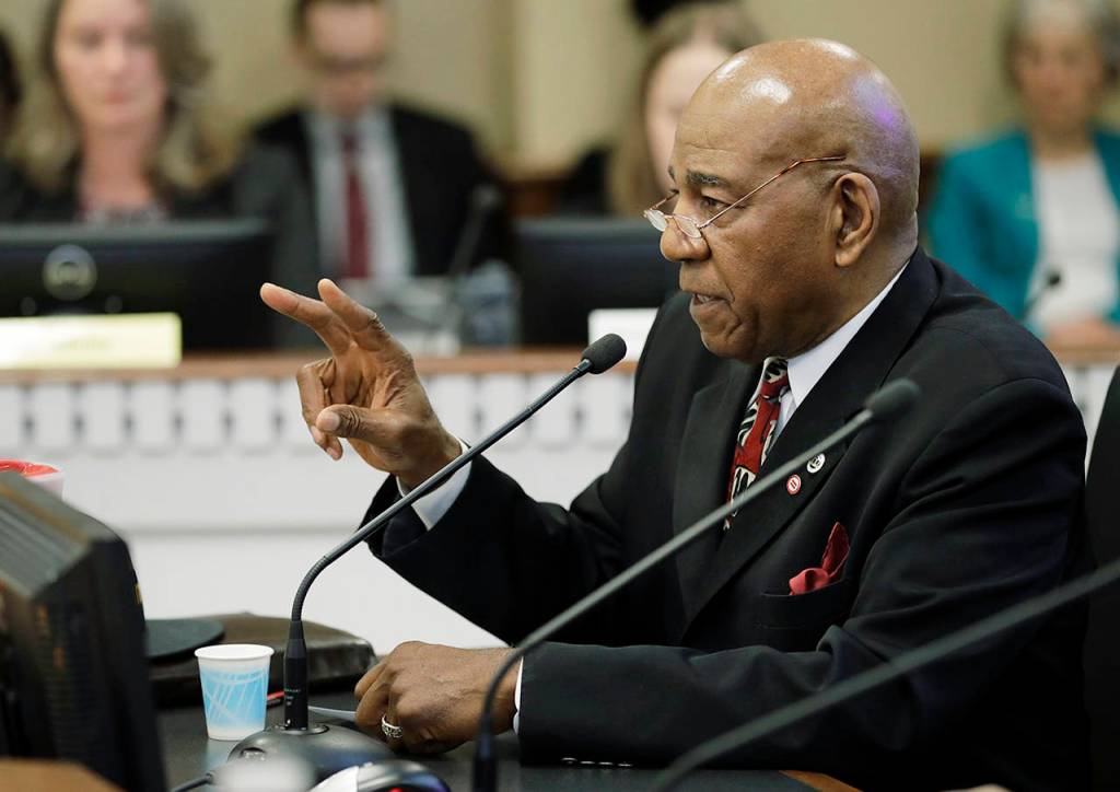 Nat Jackson, the citizen sponsor of Initiative 1000, speaks during a hearing before a joint Washington state House and Senate committee Thursday at the Capitol in Olympia. (AP Photo/Ted S. Warren)