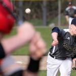 Arlingtons Jacob Burkett throws a pitch against Marysville Pilchuck during a game on April 17, 2019, at Arlington High School. (Kevin Clark / The Herald)