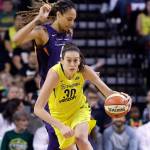 Seattles Breanna Stewart races ahead of Brittney Griner of Phoenix in the first half of a WNBA playoff last August in Seattle. (AP Photo/Elaine Thompson)
