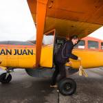 After loading passengers, San Juan Airlines pilot Rebecca Watson pulls chocks before piloting a Cessna 207 for an early morning flight out to the San Juan Islands from Bellingham International Airport on Tuesday, April 23, 2019 in Bellingham, Wash. San Juan Airlines, which has flown small charter flights from Paine Field for decades, will begin twice-daily scheduled flights from Everett to the San Juan Islands on May 1.(Andy Bronson / The Herald)