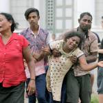 Relatives of a blast victim grieve Sunday outside a morgue in Colombo, Sri Lanka. It is the worst violence to hit the South Asian country since its civil war ended a decade ago. (AP Photo/Eranga Jayawardena)