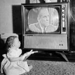 Eight-month-old Andrea Whalen holds trick rabbit that causes the television set to change channnels when the bunny is pressed and squeaks, on Feb. 6, 1961. (AP Photo, file)