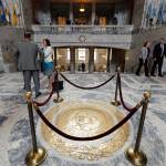 The Washington state seal is protected by ropes in the rotunda of the Legislative Building, Monday, at the Capitol in Olympia. Monday marked the start of the last week of the regular session of the Legislature. (Ted S. Warren / Associated Press)