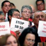 Opponents of a housing bill by State Sen. Scott Wiener, D-San Francisco, express their opinions as lawmakers debate the bill Wednesday in Sacramento, California. (AP Photo/Rich Pedroncelli)