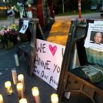 Dozens of people gathered Thursday night to remember Jae An, 58, a mini mark clerk killed in a robbery on Broadway in Everett. (Caleb Hutton / The Herald)