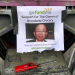 Dozens of people gathered Thursday night to remember Jae An, 58, a mini mark clerk killed in a robbery on Broadway in Everett. (Caleb Hutton / The Herald)