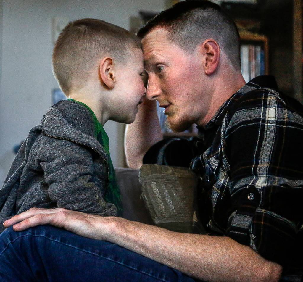 With the help of family, Daniel Fletcher is raising 4-year-old Harrison. (Dan Bates / The Herald)