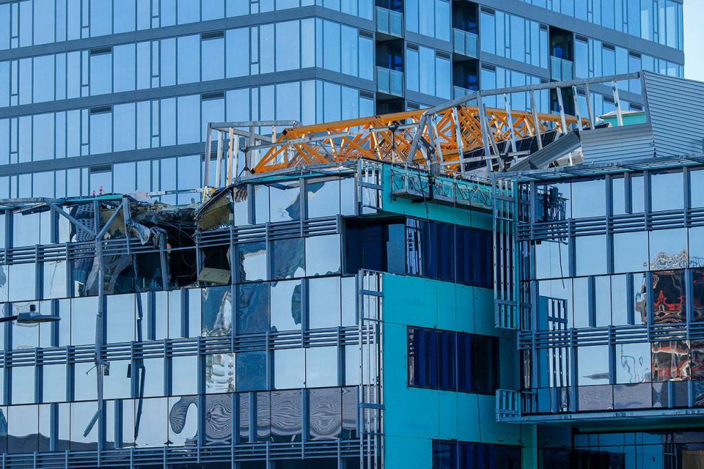 Emergency crews work at the scene of a construction crane collapse where several people were killed and others were injured Saturday in the South Lake Union neighborhood of Seattle. (AP Photo/Joe Nicholson)