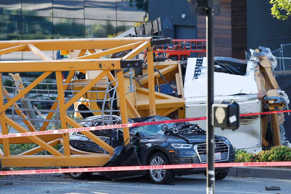 Emergency crews work at the scene of a construction crane collapse where several people were killed and others were injured Saturday in the South Lake Union neighborhood of Seattle. (AP Photo/Joe Nicholson)