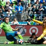 Seattle Sounders forward Jordan Morris tries to score against Los Angeles FC forward Latif Blessing and goalkeeper Tyler Miller in the second half of Sundays game in Seattle. Morris scored the Sounders lone goal in the 1-1 draw. (Bettina Hansen/The Seattle Times via AP)