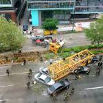 Firefighters and police work to clear the scene where a construction crane fell from a building on Googles new Seattle campus on Saturday. (AP Photo/Frank Kuin)