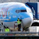 A worker checks sensors on a Boeing 737 MAX 8 airplane being built for TUI Group at the Boeing Co.s Renton assembly plant March 13. (AP Photo/Ted S. Warren)