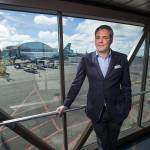Propeller Airports CEO Brett Smith, who has been awarded the John M. Fluke Sr. Award, poses on a jet bridge at Paine Fields new passenger terminal. The award recognizes someone who has demonstrated entrepreneurial spirit and community leadership. (Andy Bronson / The Herald)
