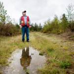 Boyd Norton pauses while walking through the Nourse Tree Farm near Arlington on April 19. (Olivia Vanni / The Herald)