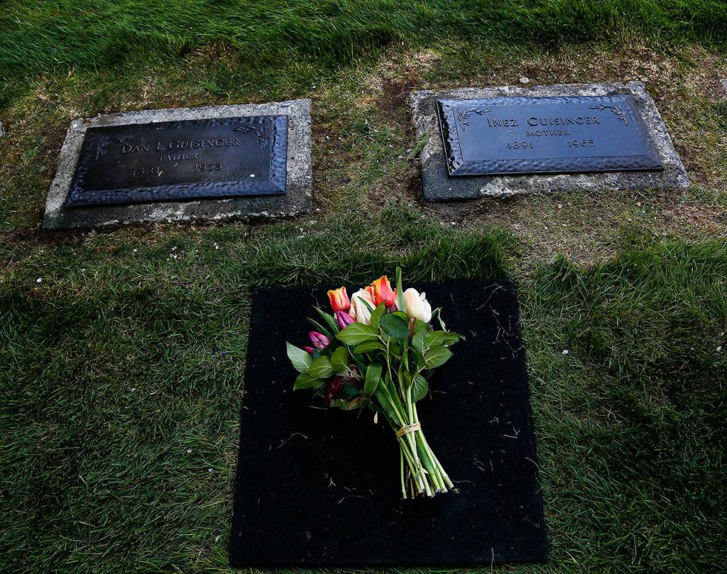 Flowers placed by a family member decorate the grave of Daniel Guisinger Jr., an Everett sailor killed at Pearl Harbor. He was buried April 27 between his parents, Daniel Sr. and Inez Guisinger, at Cypress Lawn Memorial Park. (Dan Bates / The Herald)
