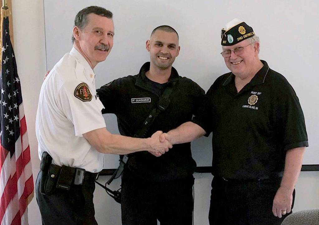 American Legion Department of Washington Fireman of the Year Lt. Roberto Guadamuz (center) of the Camano Fire and Rescue, Assistant Chief Craig Helgeland (left) and Post 207 Commander Jeff Westlund. (Contributed photo)