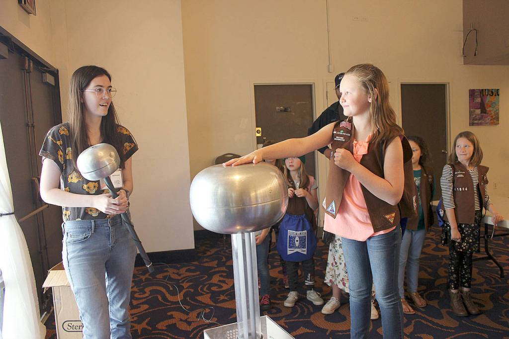 Cozette Vallerie (right) experiments with a Van De Graff provided by Imagine Childrens Museum. (Submitted photo)