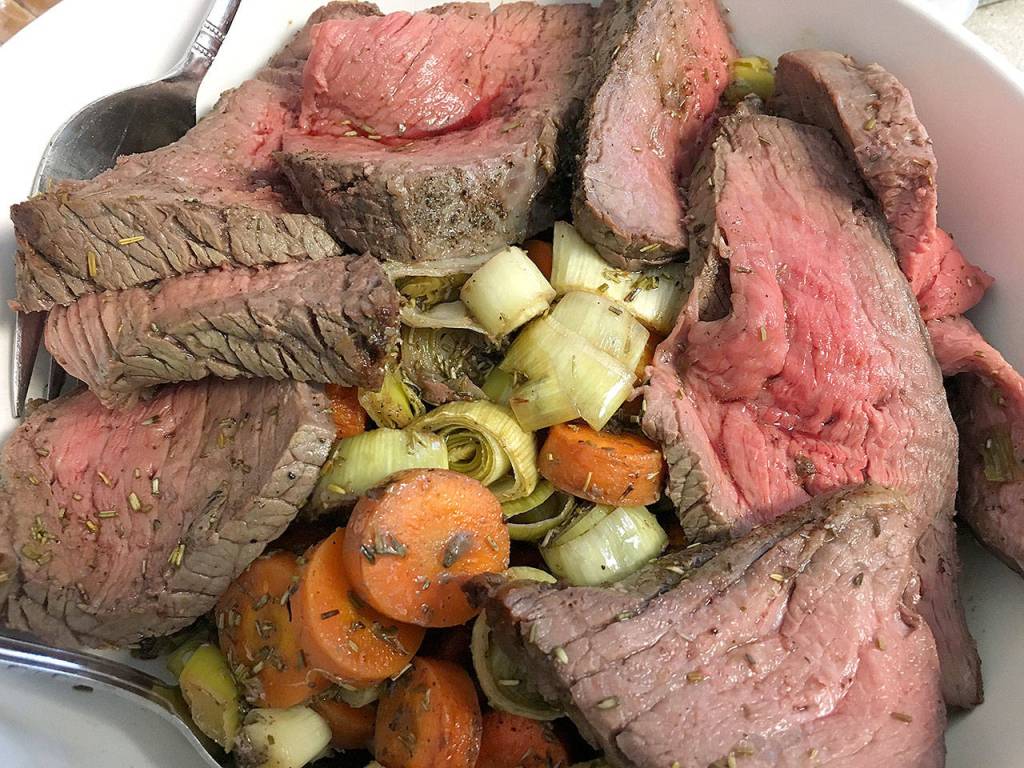 The roast aurochs with carrots and leeks, ready to be served, is a hearty dish from the cookbook, A Feast of Ice & Fire: The Official Companion Cookbook to the HBO show Game of Thrones. (Ben Watanabe / The Herald)
