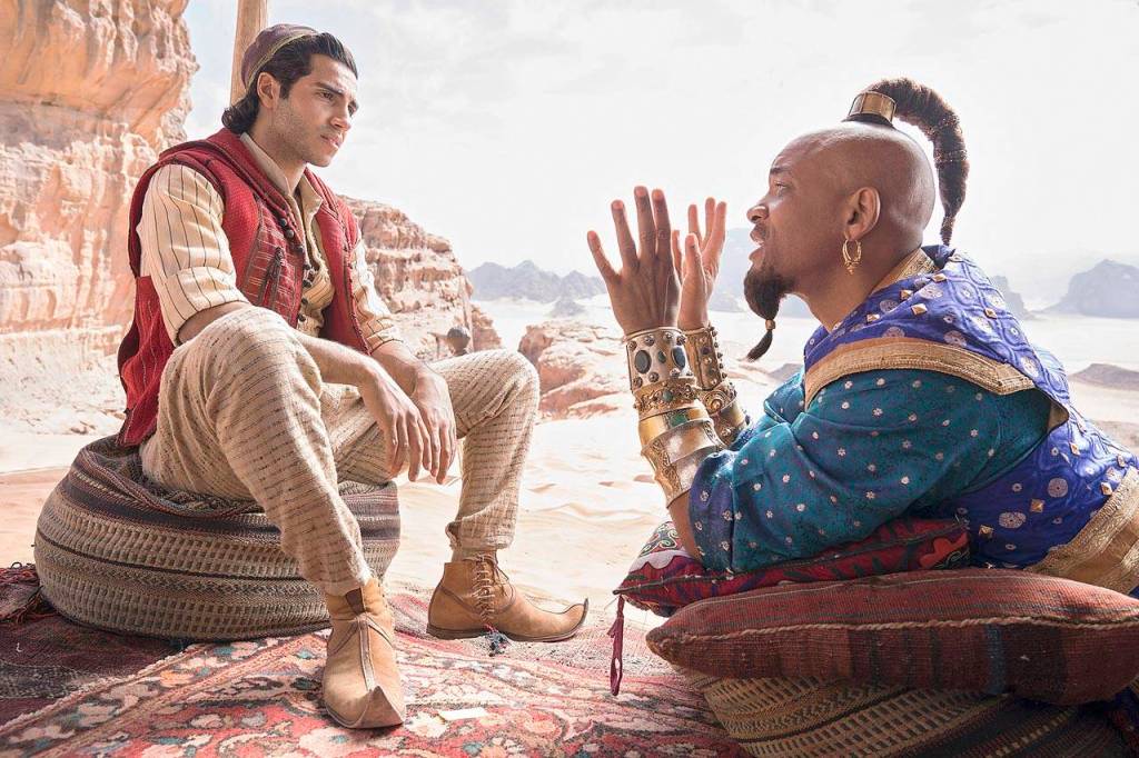 Mena Massoud and Will Smith (in the Robin Williams role) in a live-action remake of Aladdin, coming May 24. (Walt Disney Pictures)