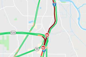 Man trying to cross I-5 hit, injured by two trucks in Everett