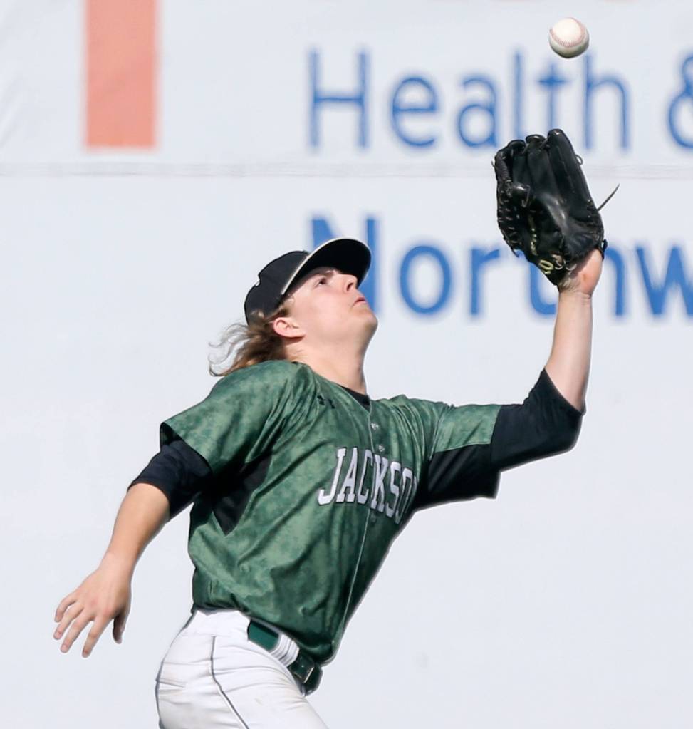 Jacksons Jeremy Vierra reaches out to catch a fly ball. (Kevin Clark / The Herald)