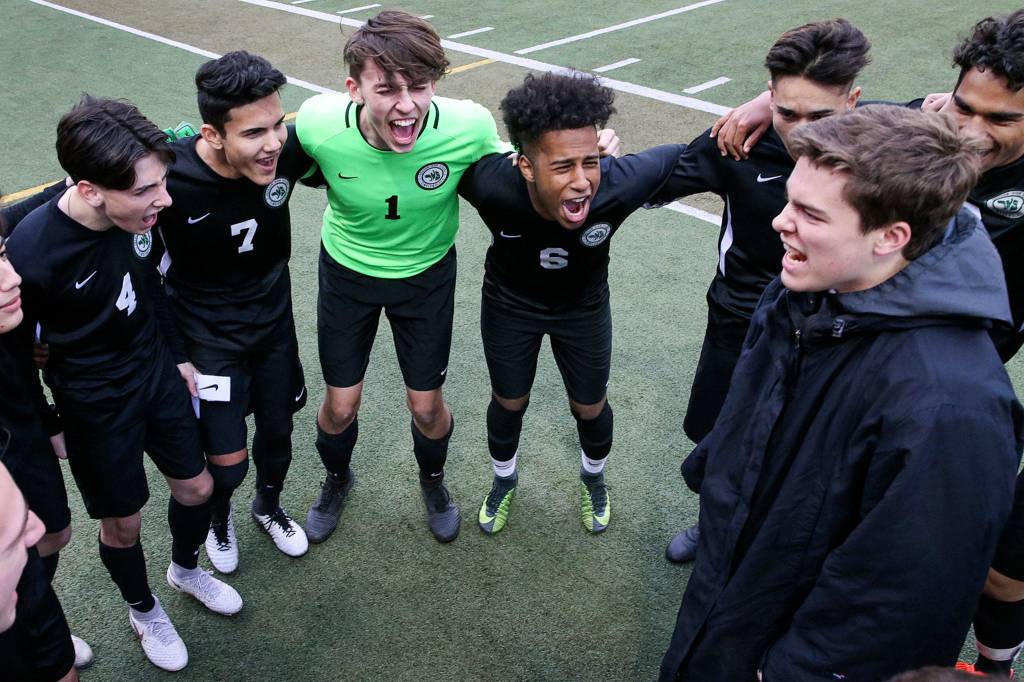 Members of the Henry M. Jackson soccer rally before a game against Cascade at Everett Memorial Stadium on April 26. (Kevin Clark / The Herald)