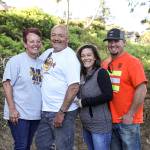 Marie Grady (left to right), Johnny Wickerling, Kimberly Kelley and Jason Kelley, helped clean up a neighborhood playground in the South Forest Park area. (Lizz Giordano / The Herald)